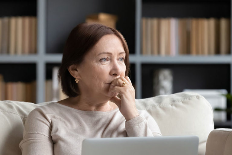 Questioning Dental Patient Wondering If She Should Get Dental Implants Or Dentures