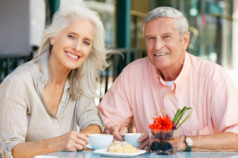 Dental Implant Patients Eating Together With Their False Teeth in Monroe, CT